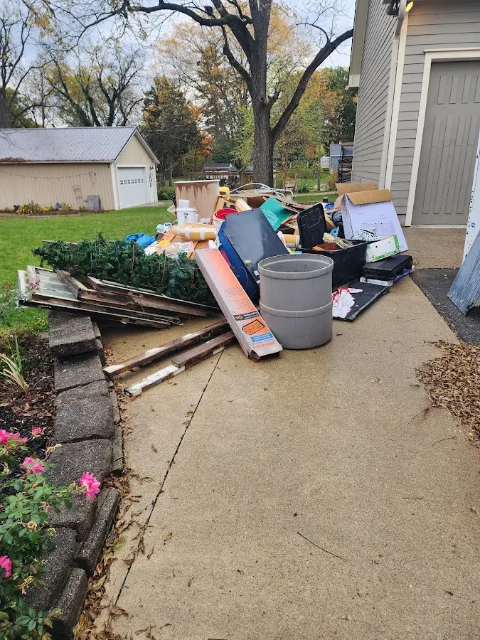 Dumpster being loaded with debris for Commercial Dumpster Rental in Swanton